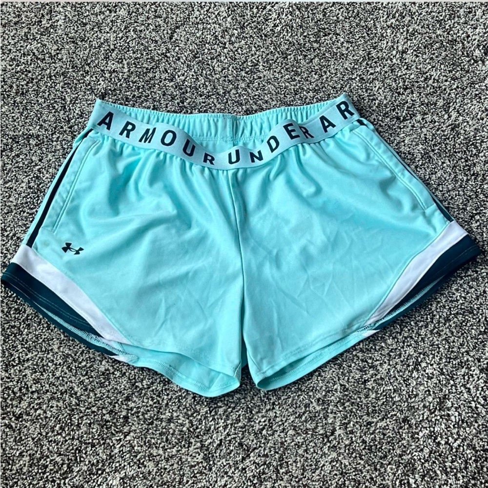 Under Armour baby blue and white shorts.